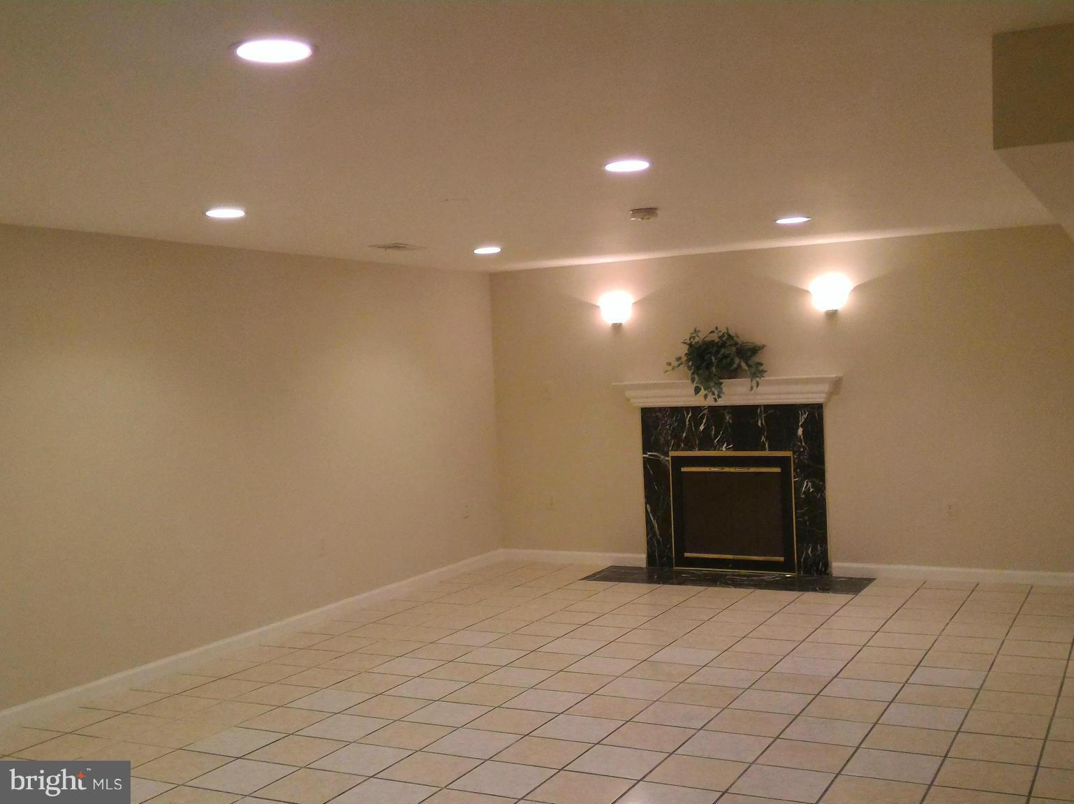 16512 Walnut Hill Road Gaithersburg, MD 20877 - Photo 6 of 20 a view of empty room with wooden floor