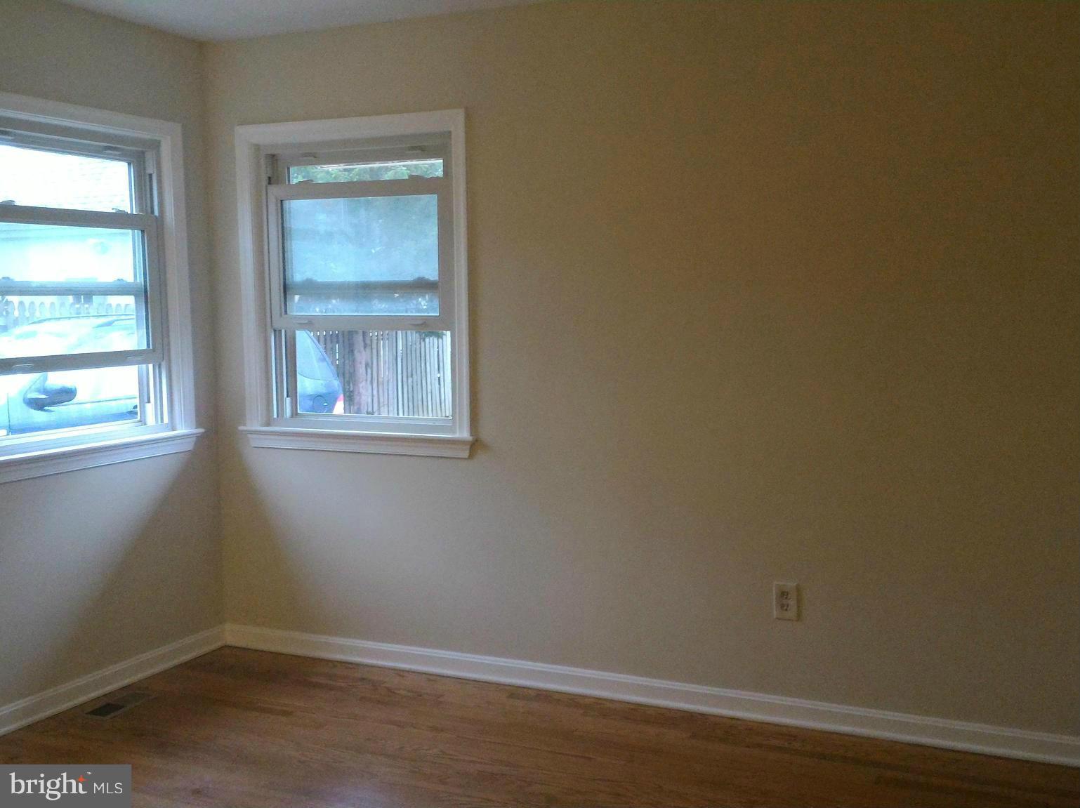 16512 Walnut Hill Road Gaithersburg, MD 20877 - Photo 7 of 20 a view of a small space with wooden floor and a window