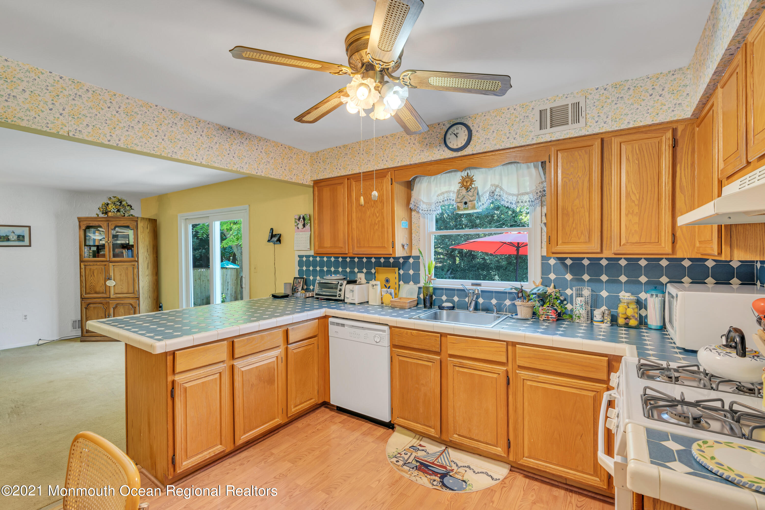 2221 Old Mill Road Spring Lake Heights, NJ 07762 - Photo 12 of 50 a kitchen with a sink stove and cabinets