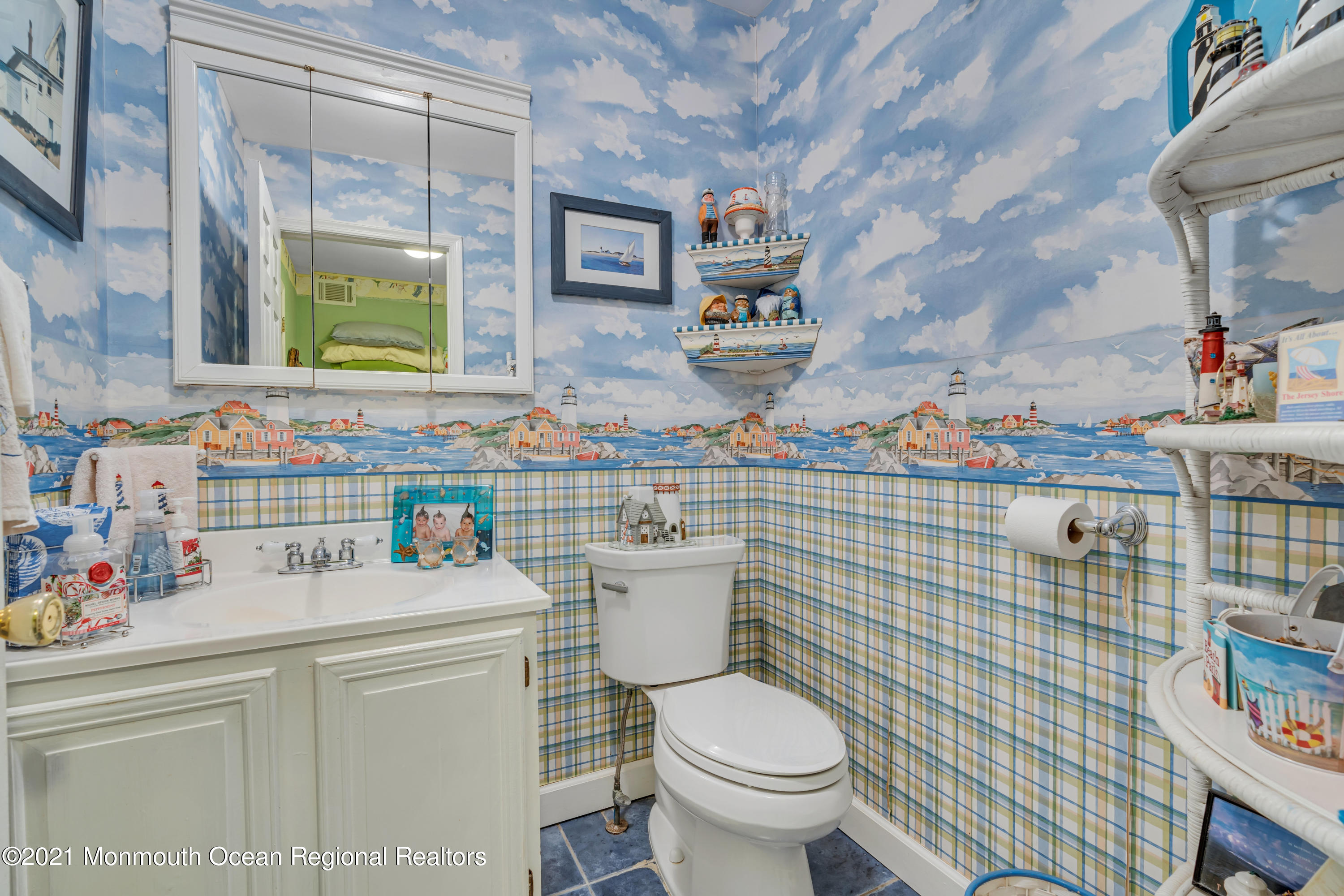 2221 Old Mill Road Spring Lake Heights, NJ 07762 - Photo 14 of 50 a bathroom with a toilet sink vanity and mirror