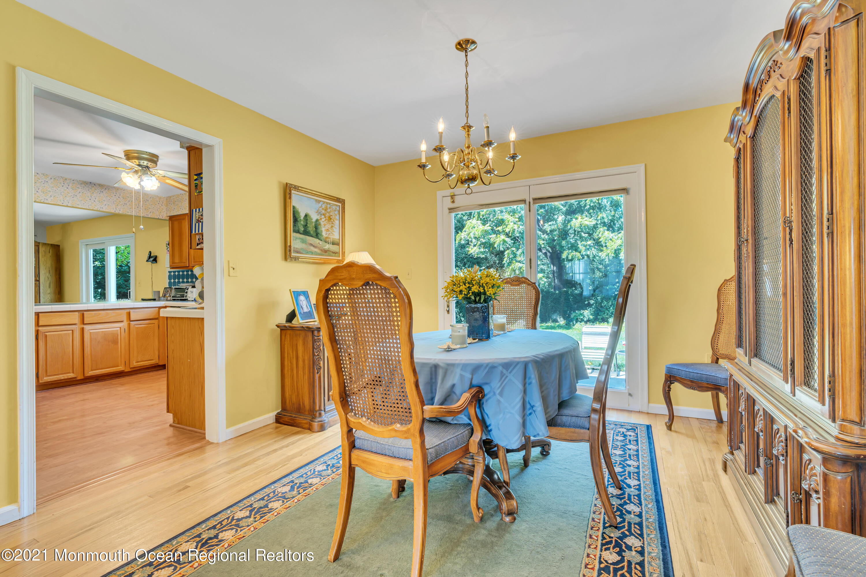 2221 Old Mill Road Spring Lake Heights, NJ 07762 - Photo 21 of 50 a view of a dining room with furniture window and wooden floor