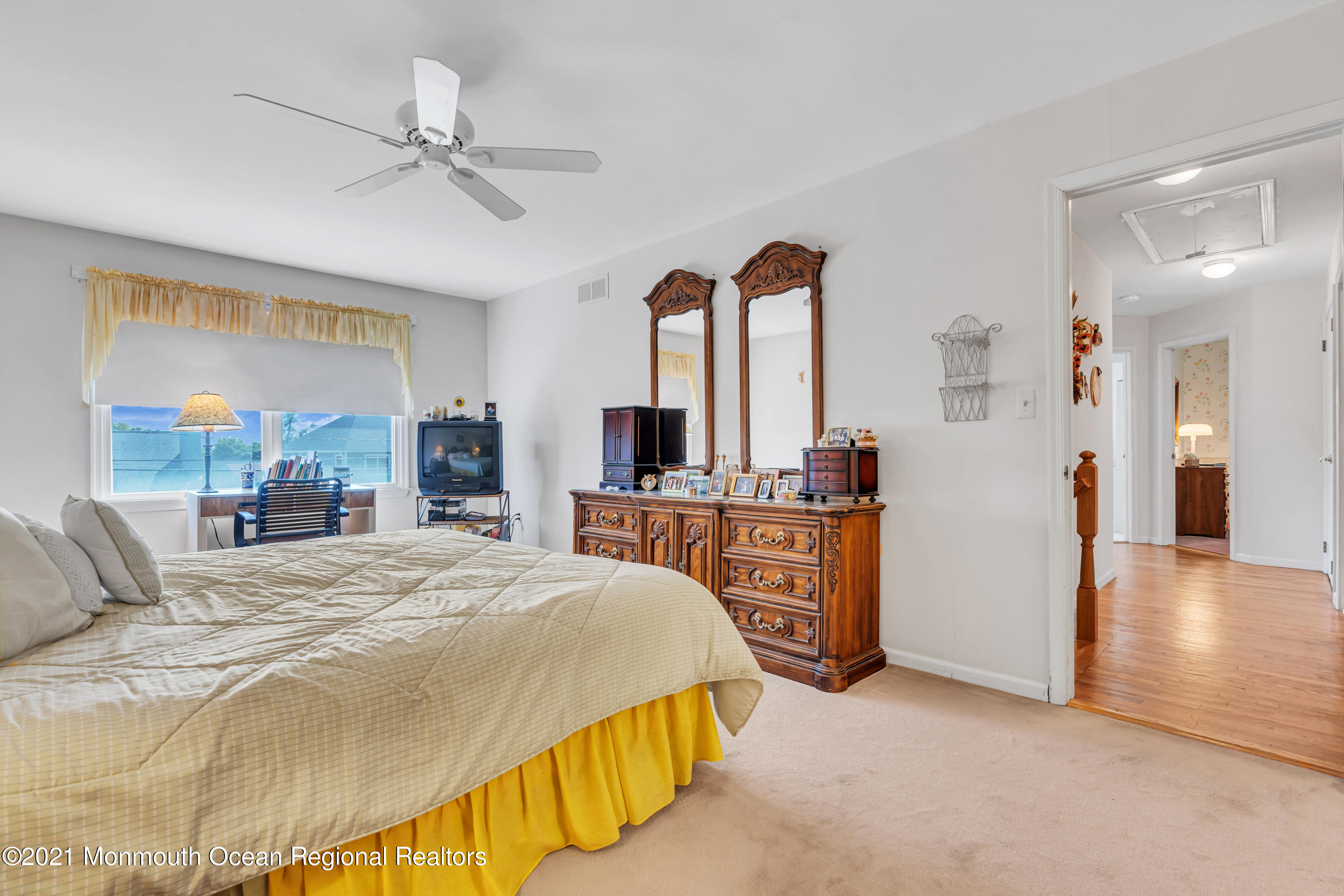 2221 Old Mill Road Spring Lake Heights, NJ 07762 - Photo 24 of 50 a bedroom with a bed a ceiling fan and a dresser