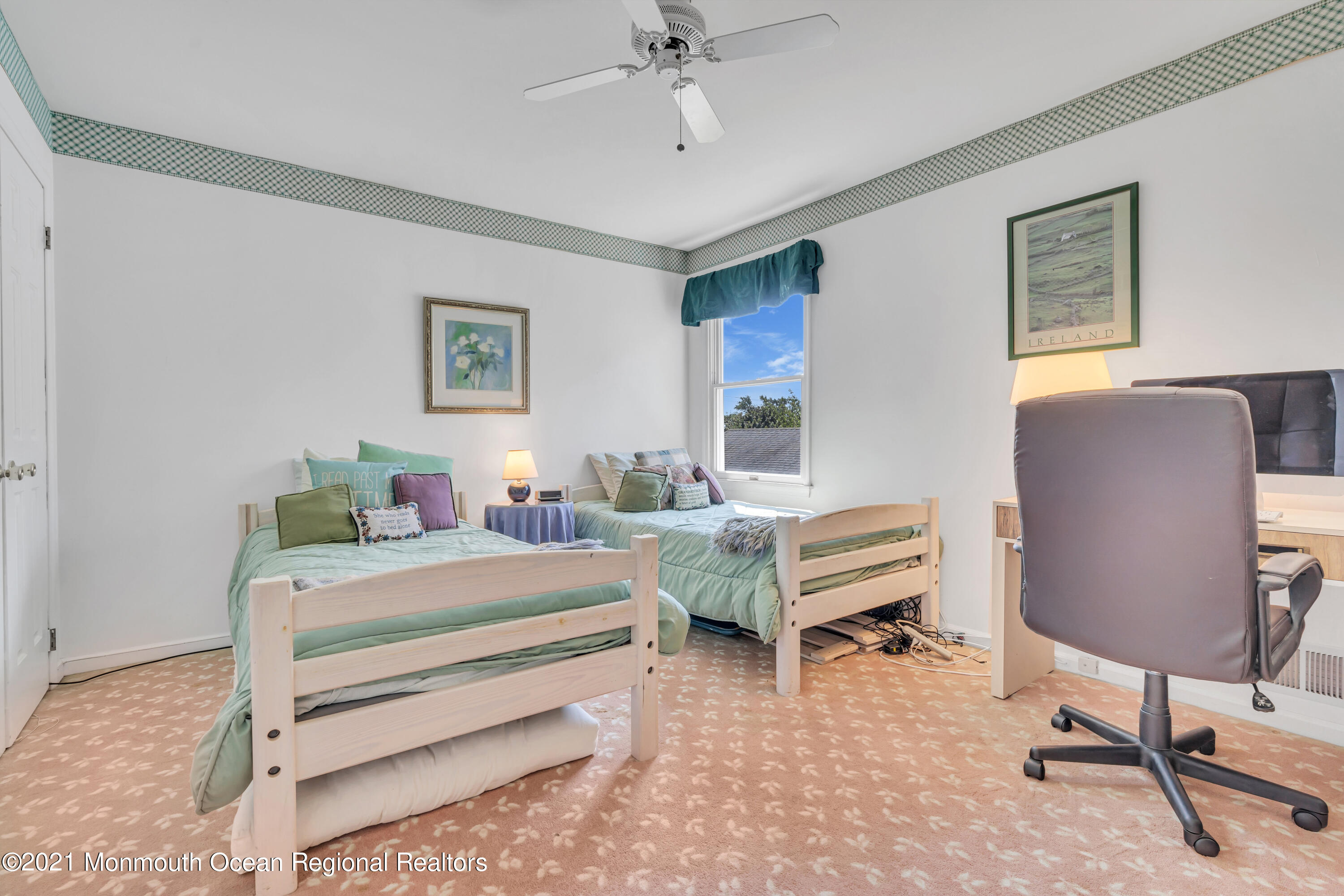 2221 Old Mill Road Spring Lake Heights, NJ 07762 - Photo 27 of 50 a bedroom with a bed and a chandelier