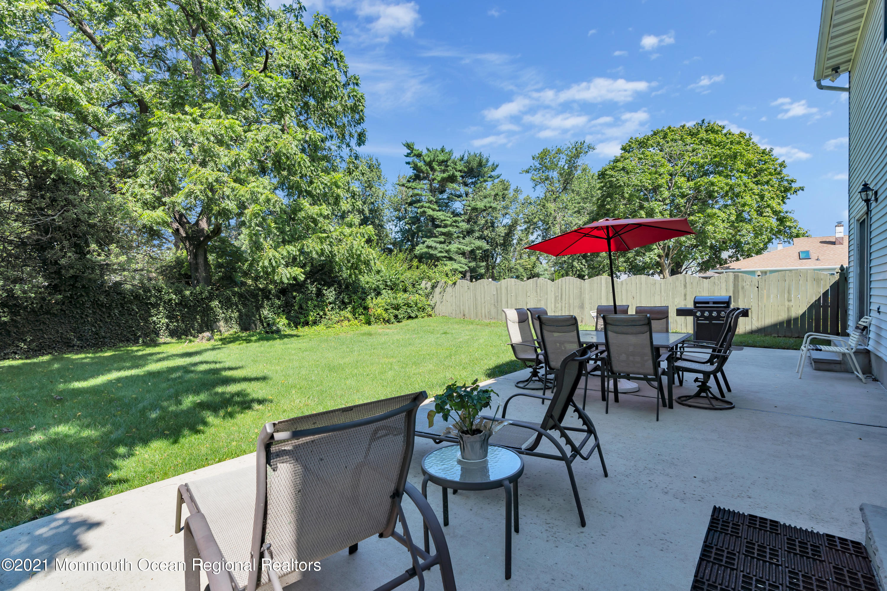 2221 Old Mill Road Spring Lake Heights, NJ 07762 - Photo 32 of 50 a view of a patio with furniture and a yard