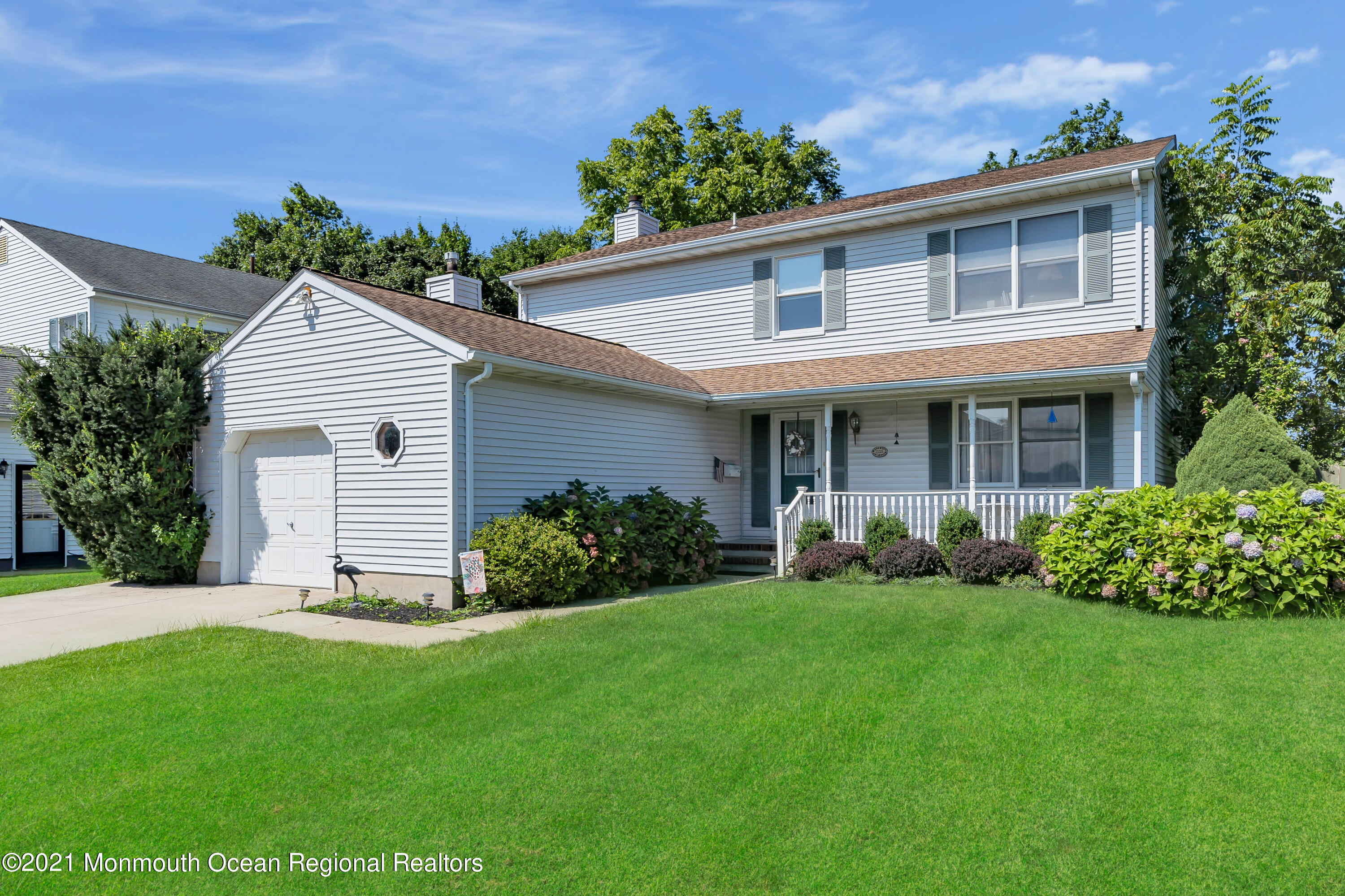 2221 Old Mill Road Spring Lake Heights, NJ 07762 - Photo 36 of 50 a front view of a house with a garden and yard