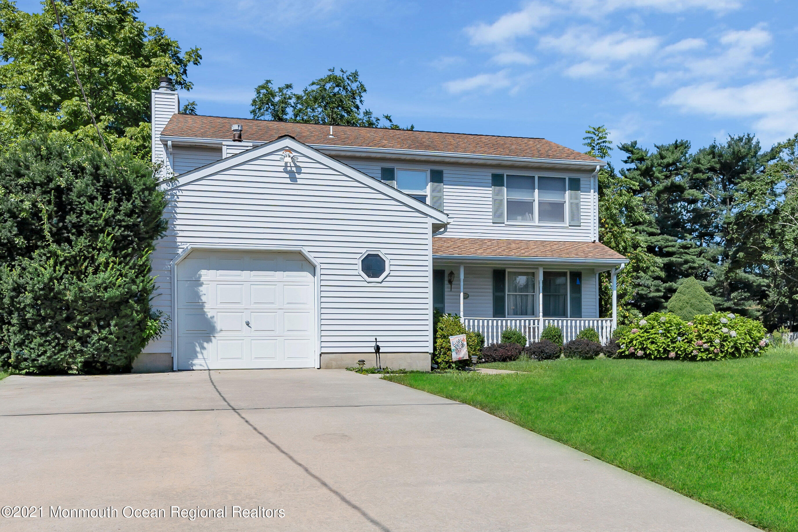 2221 Old Mill Road Spring Lake Heights, NJ 07762 - Photo 37 of 50 a front view of a house with a garden and plants