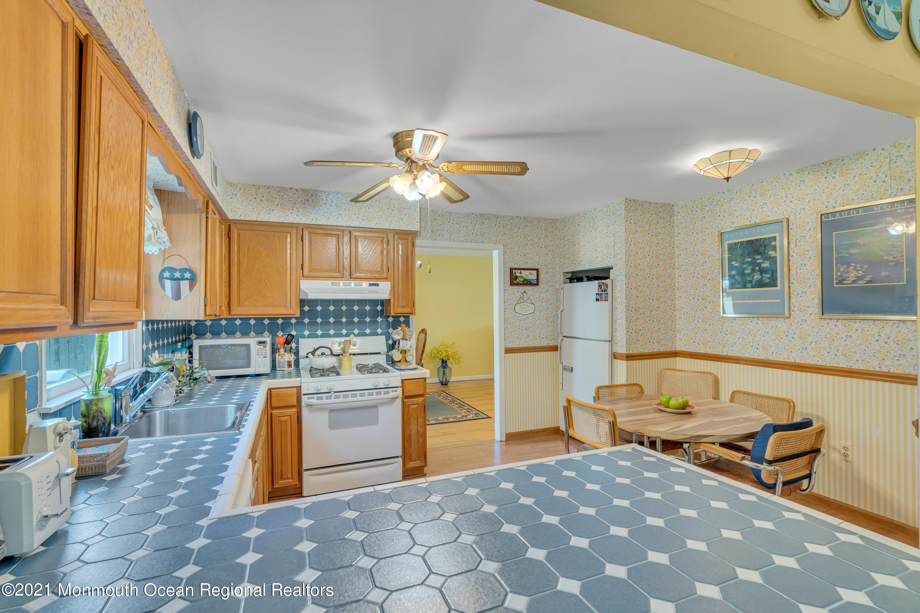2221 Old Mill Road Spring Lake Heights, NJ 07762 - Photo 10 of 50 a kitchen with stainless steel appliances granite countertop a sink dishwasher stove top oven and cabinets
