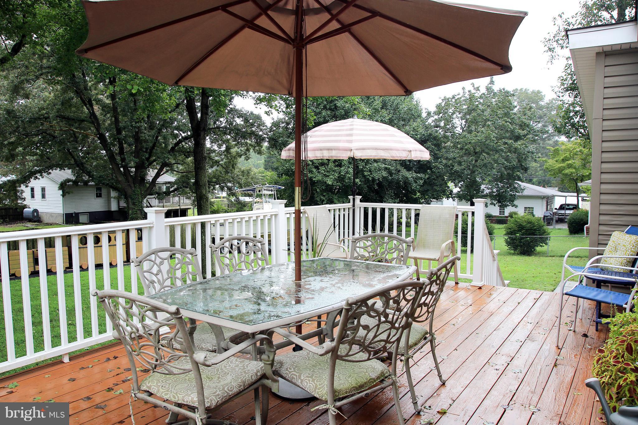 765 Evergreen Road Severn, MD 21144 - Photo 21 of 23 a view of balcony with wooden floor and outdoor seating