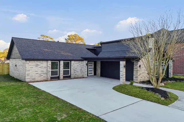 a front view of a house with a garage