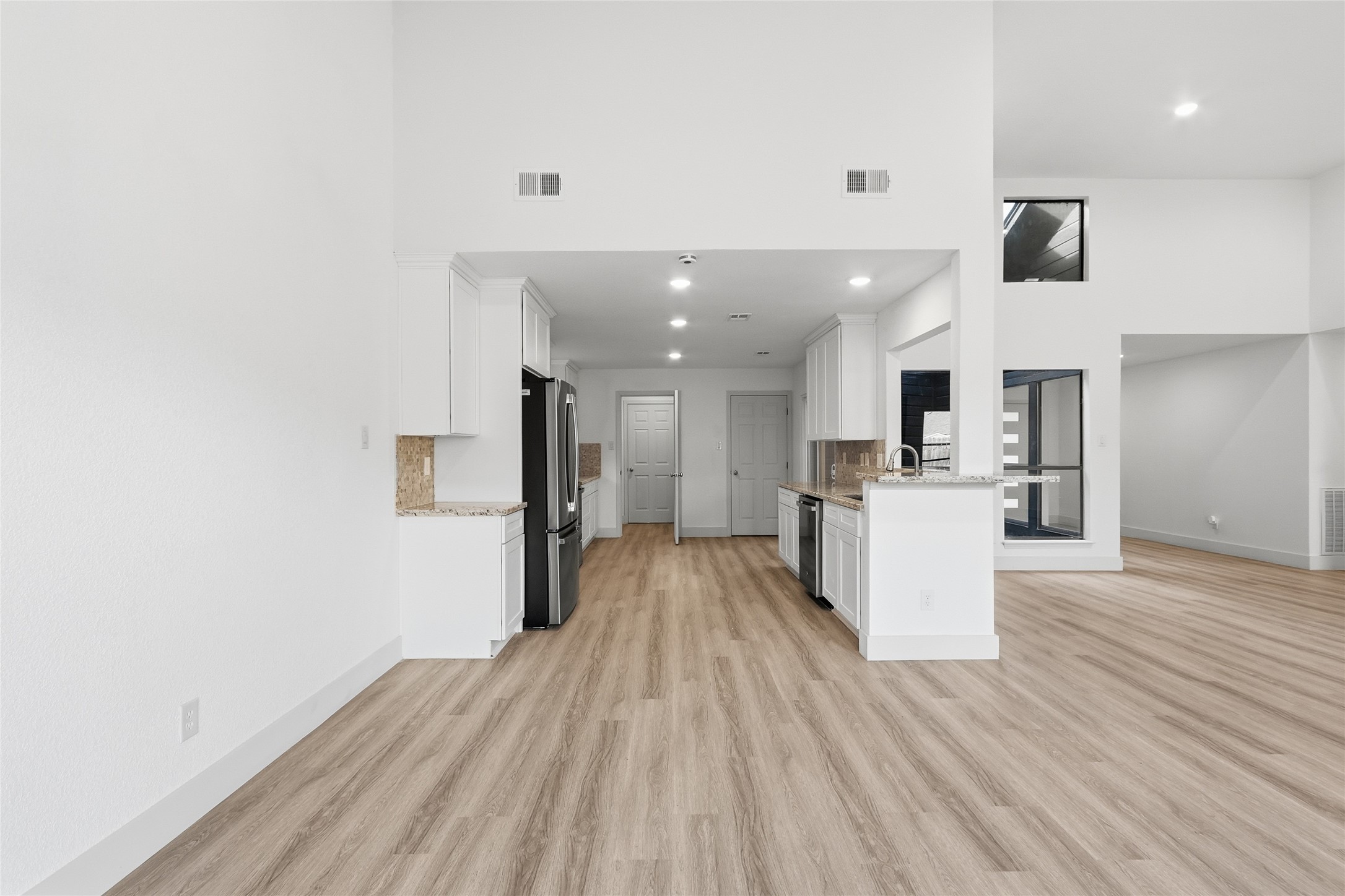 19110 Baton Pass Humble, TX 77346 - Photo 11 of 41 a view of kitchen with furniture and wooden floor