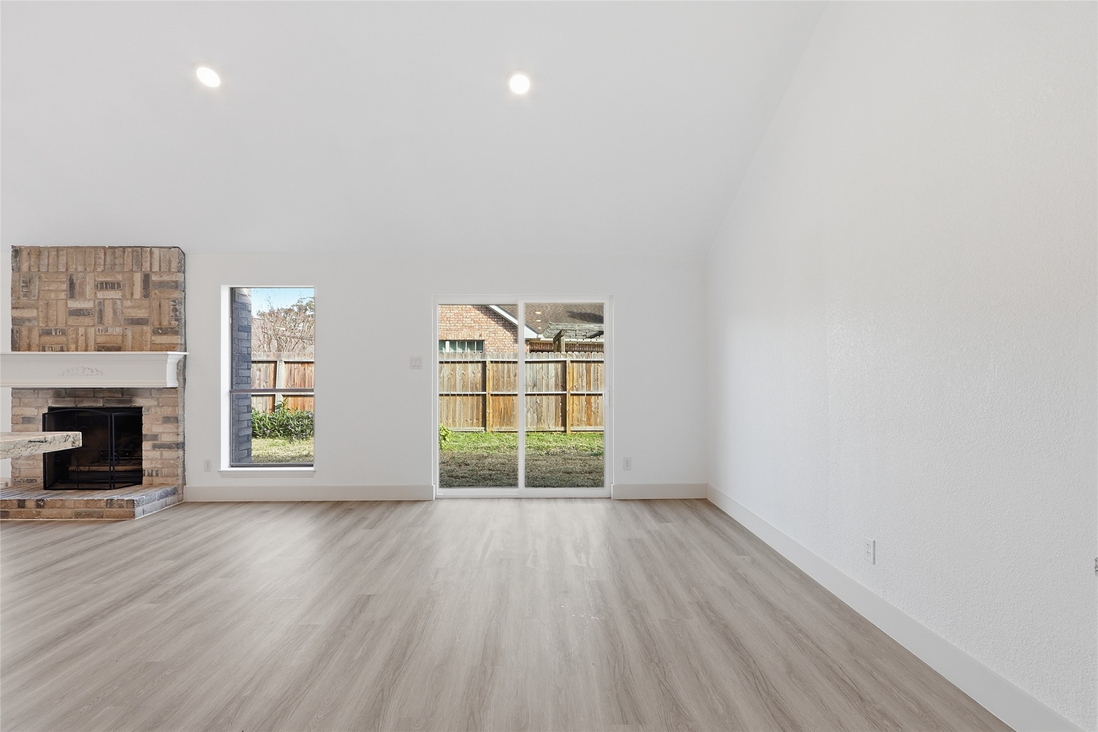 19110 Baton Pass Humble, TX 77346 - Photo 18 of 41 wooden floor in an empty room with a window