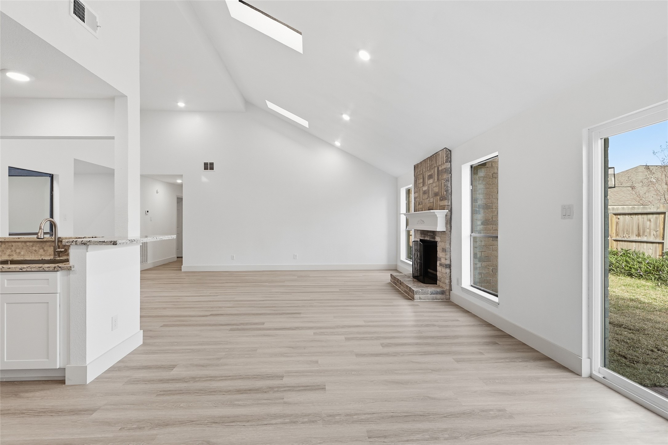 19110 Baton Pass Humble, TX 77346 - Photo 19 of 41 a view of a kitchen with a refrigerator and a sink