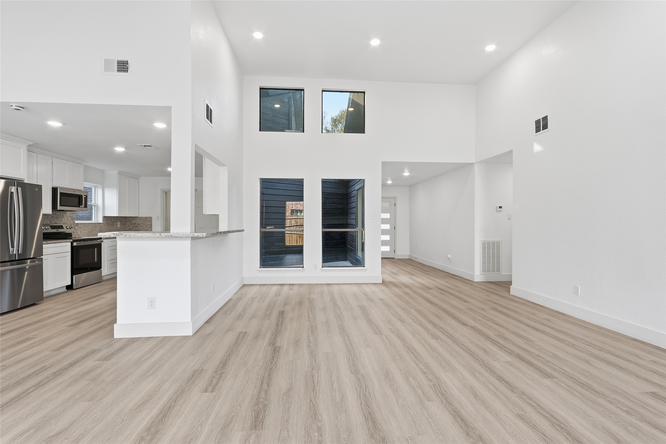 19110 Baton Pass Humble, TX 77346 - Photo 20 of 41 a view of kitchen with cabinets and wooden floor