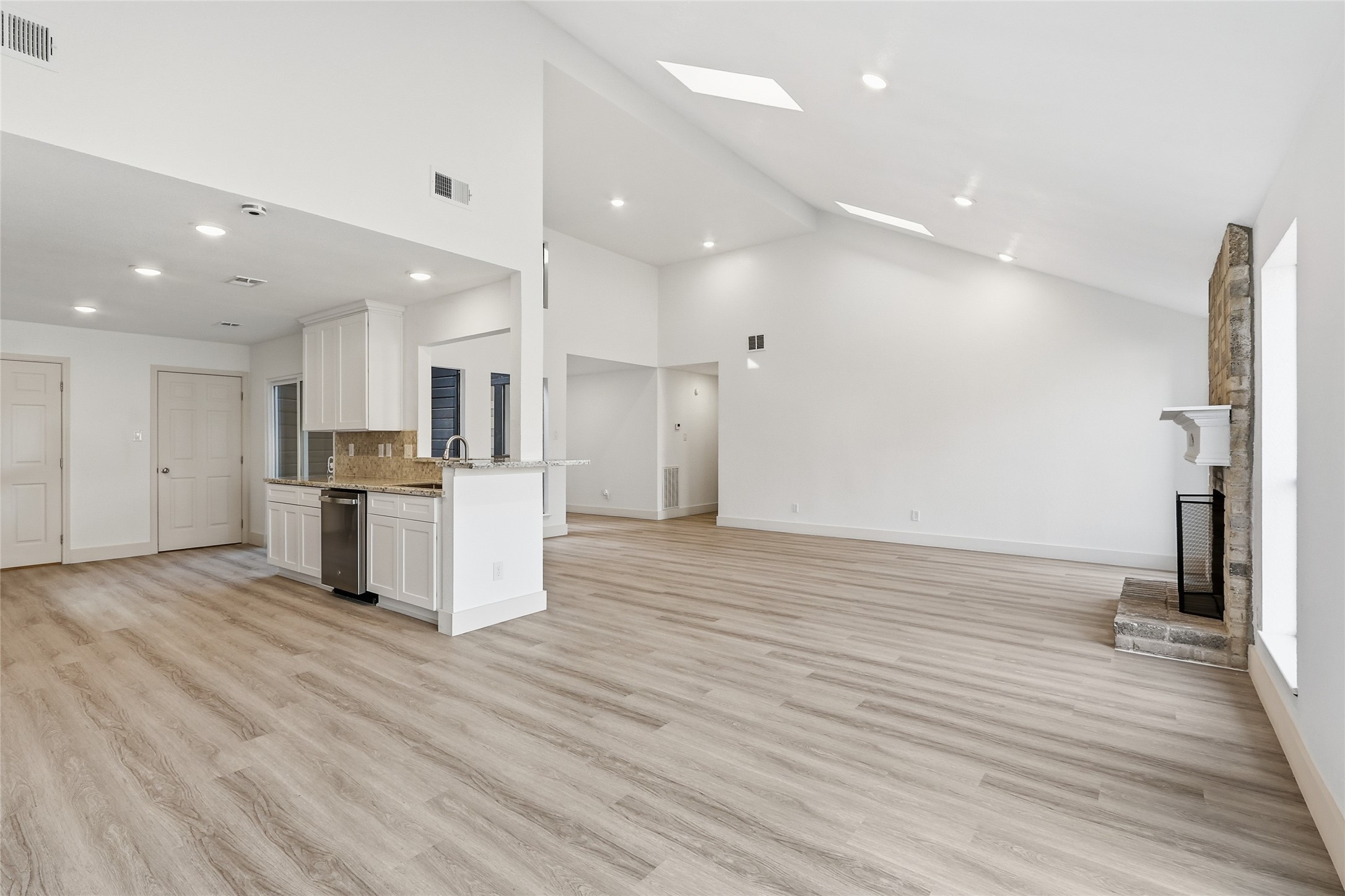 19110 Baton Pass Humble, TX 77346 - Photo 21 of 41 view of the kitchen and living room from the dining area.