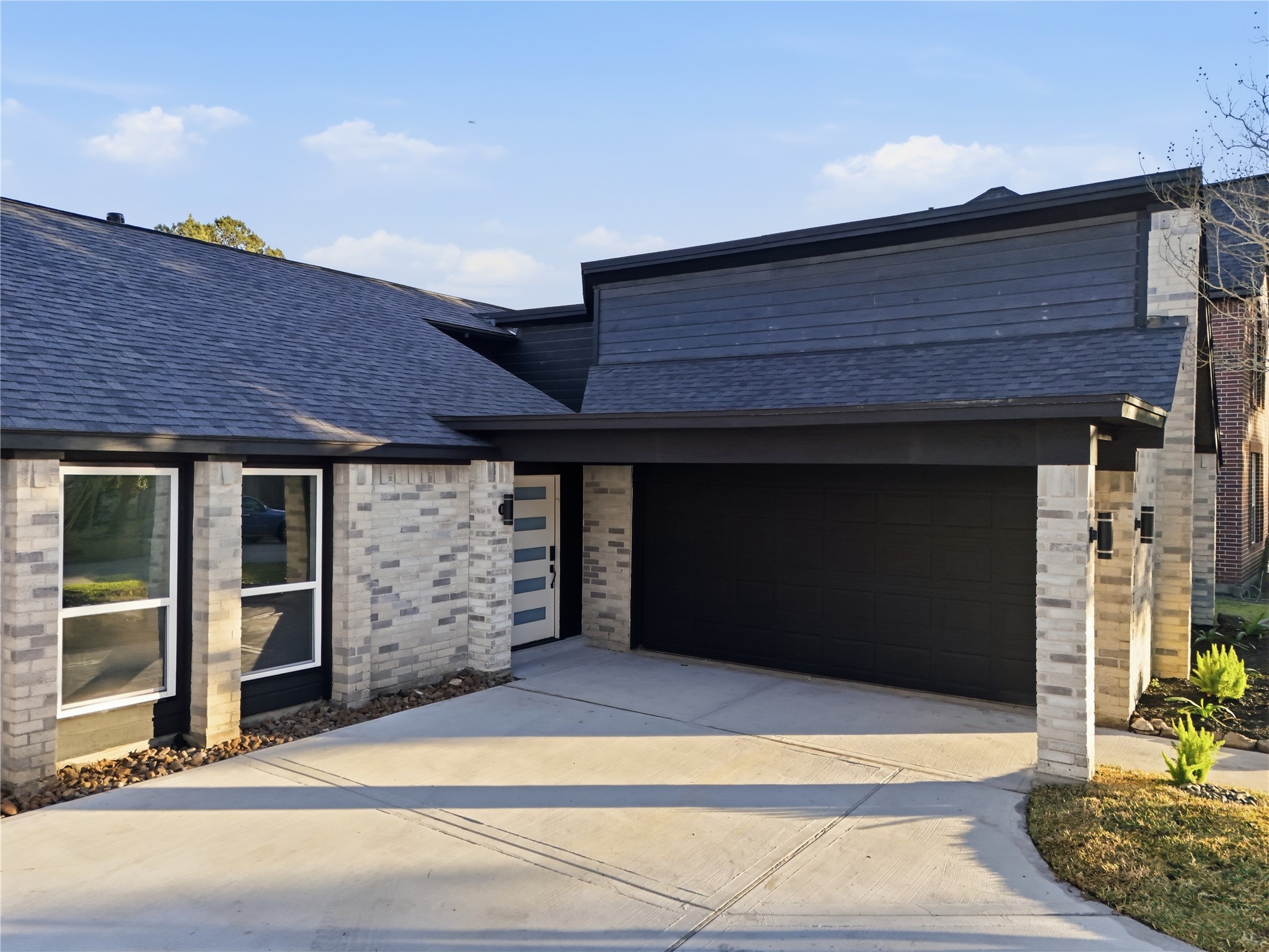 19110 Baton Pass Humble, TX 77346 - Photo 3 of 41 a front view of a house with a garage