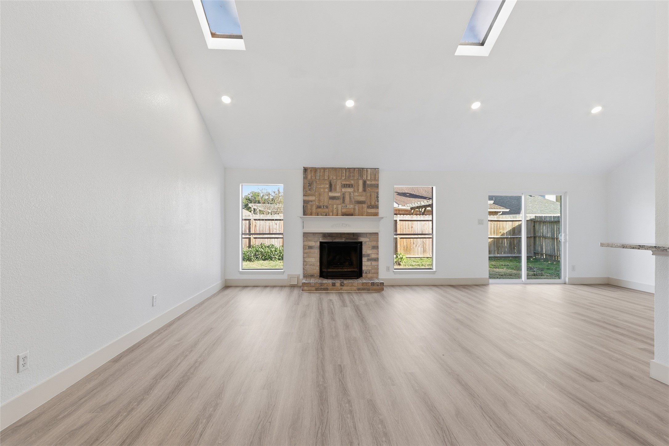 19110 Baton Pass Humble, TX 77346 - Photo 8 of 41 Huge living room area with natural light, facing the gas fireplace.