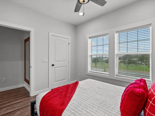 a bedroom with a bed and a window