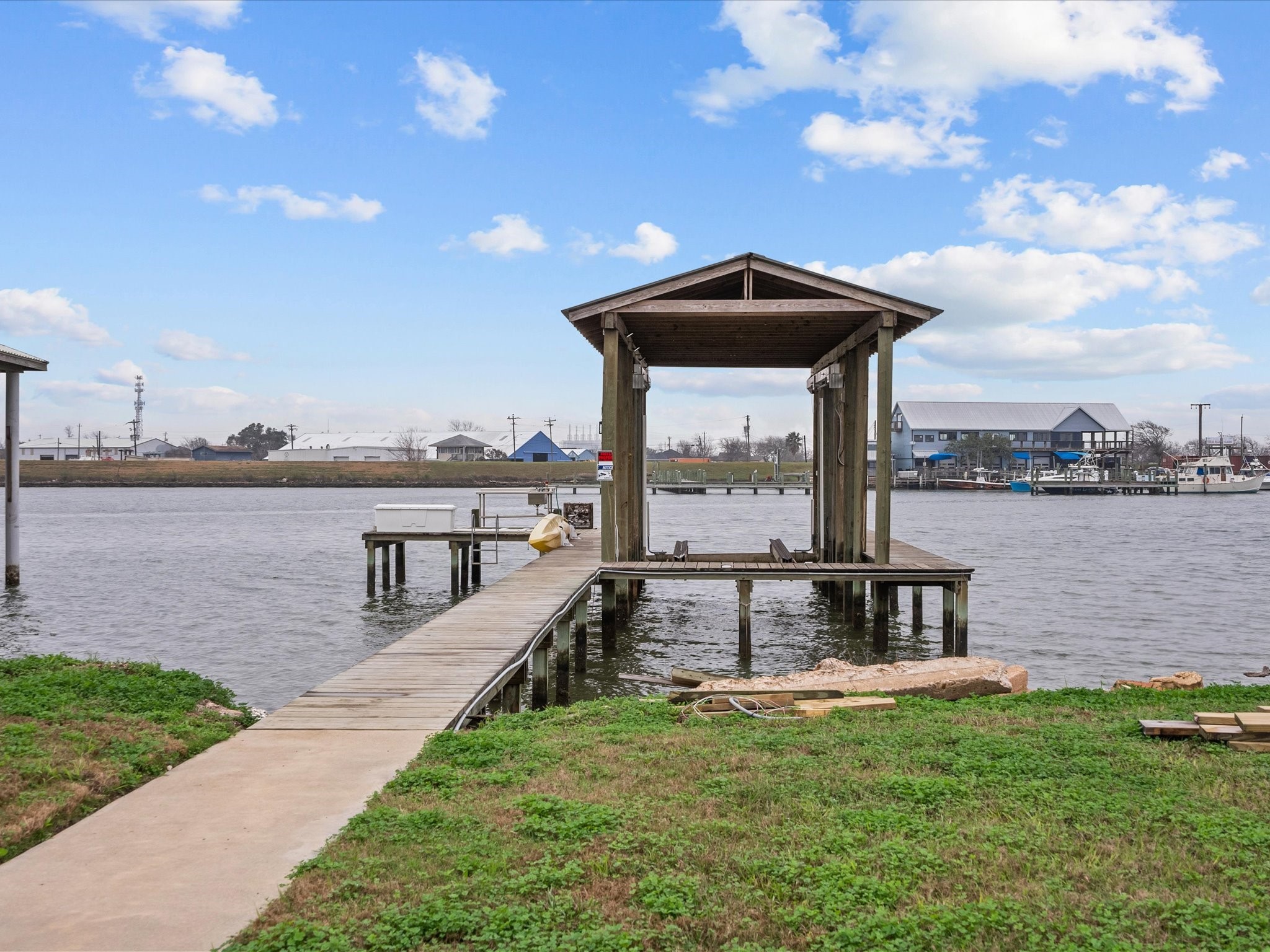 822 West 2nd Street Freeport, TX 77541 - Photo 4 of 46 a view of a lake with a garden and lake view