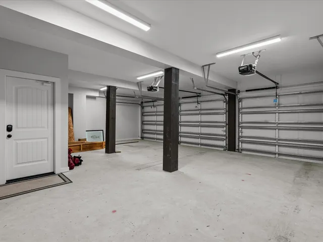 a view of an empty room with white walls