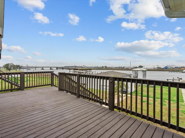 a view of a balcony with wooden floor