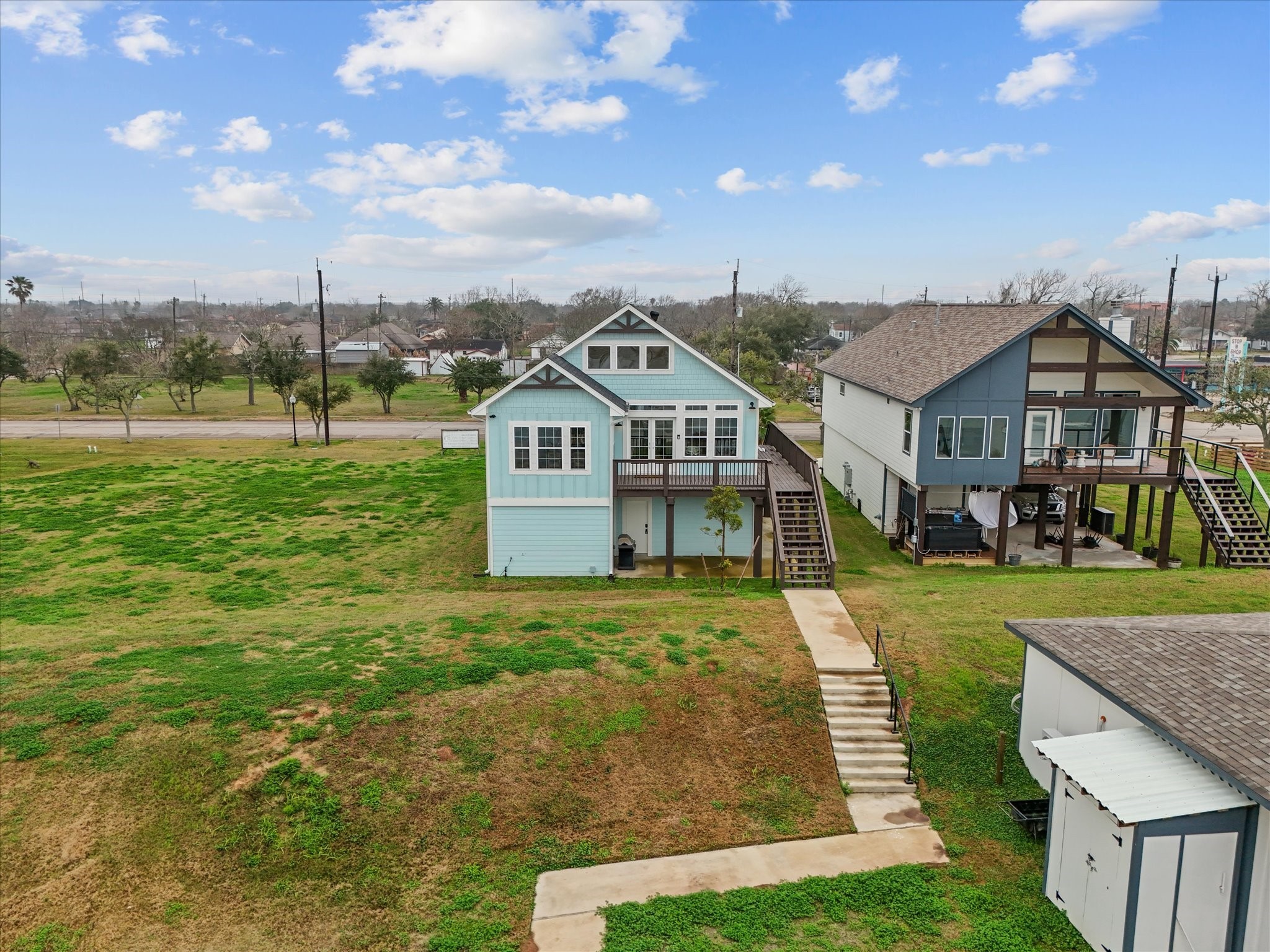 822 West 2nd Street Freeport, TX 77541 - Photo 7 of 46 a front view of a house with garden