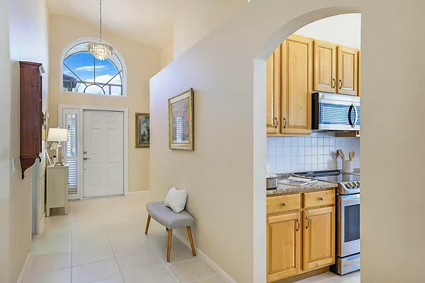a kitchen with stainless steel appliances granite countertop a refrigerator a stove a sink and a refrigerator