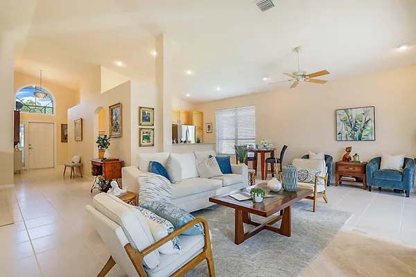a living room with furniture and a large window