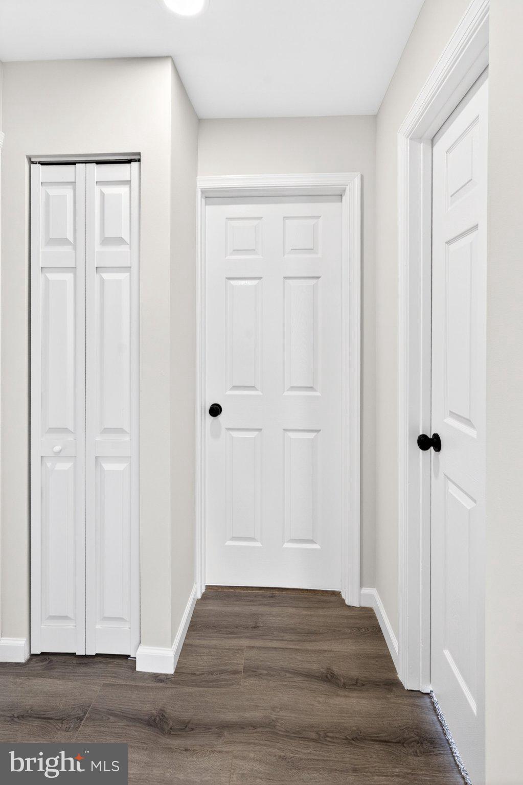 9081 Dumhart Road Laurel, MD 20723 - Photo 30 of 45 Inviting hallway with sleek doors.