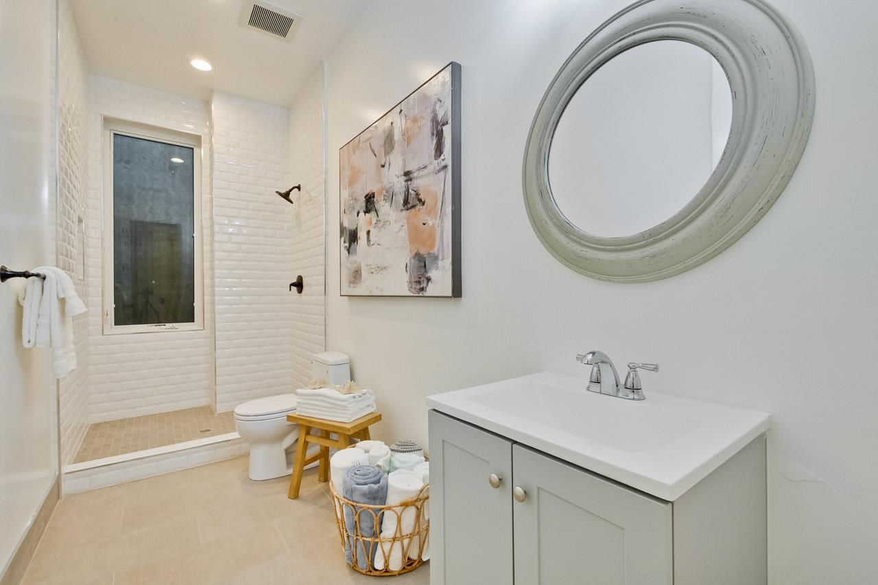 10326 Prune Tree Lane Cupertino, CA 95014 - Photo 15 of 95 a bathroom with a sink a toilet and shower