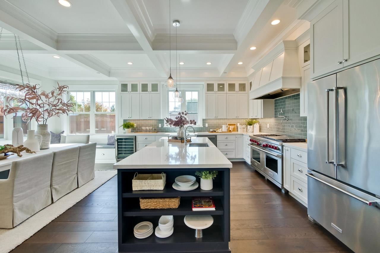 10326 Prune Tree Lane Cupertino, CA 95014 - Photo 28 of 95 a kitchen with stainless steel appliances granite countertop a sink refrigerator and cabinets