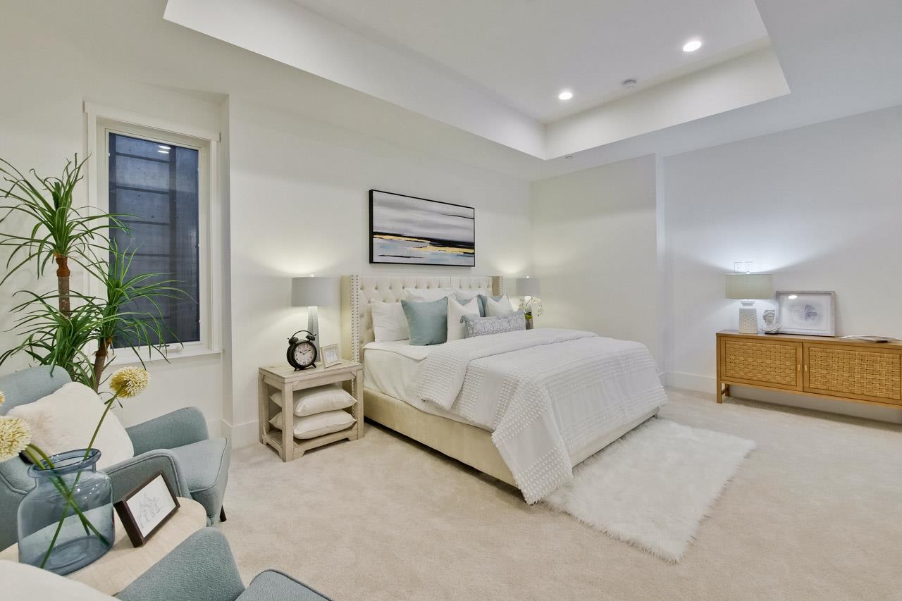 10326 Prune Tree Lane Cupertino, CA 95014 - Photo 50 of 95 a bedroom with a bed and a couch