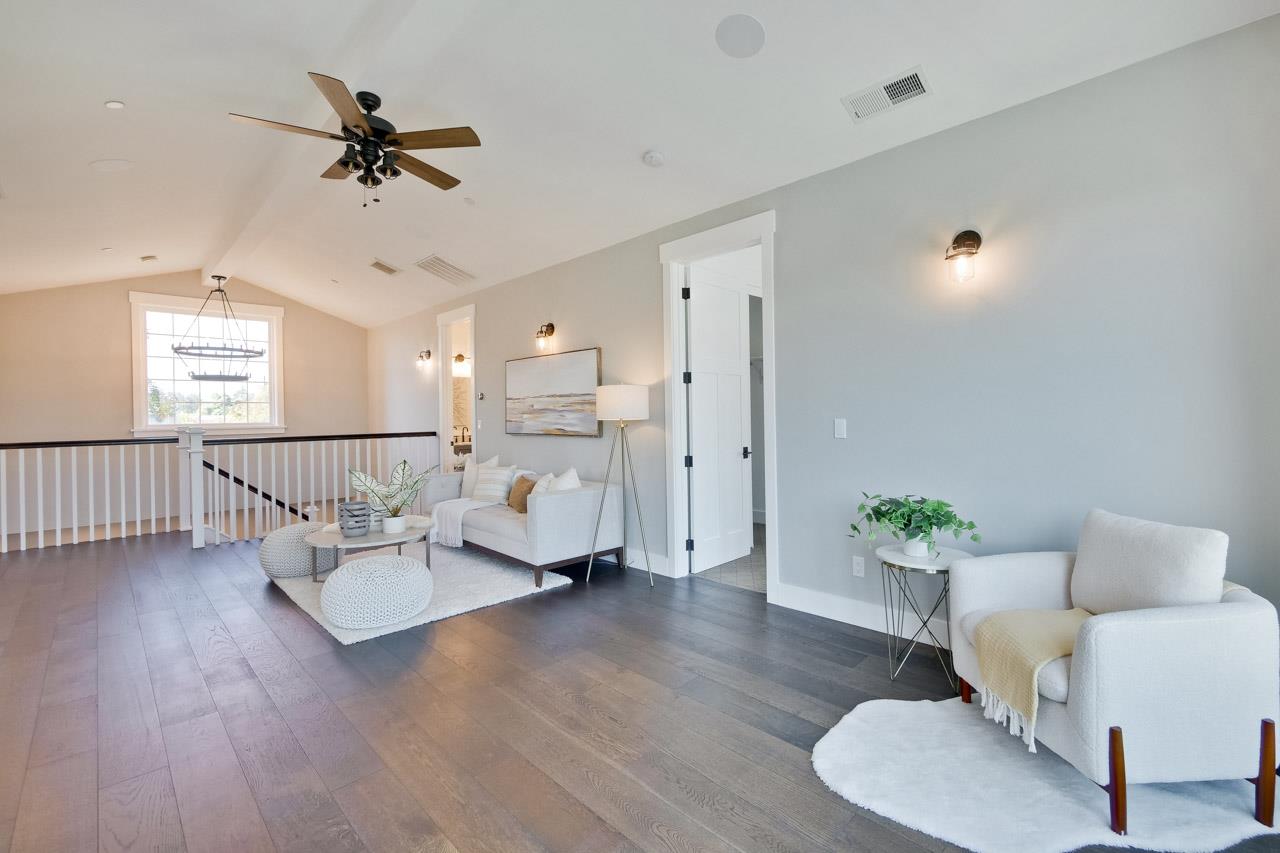 10326 Prune Tree Lane Cupertino, CA 95014 - Photo 52 of 95 a living room with furniture and wooden floor