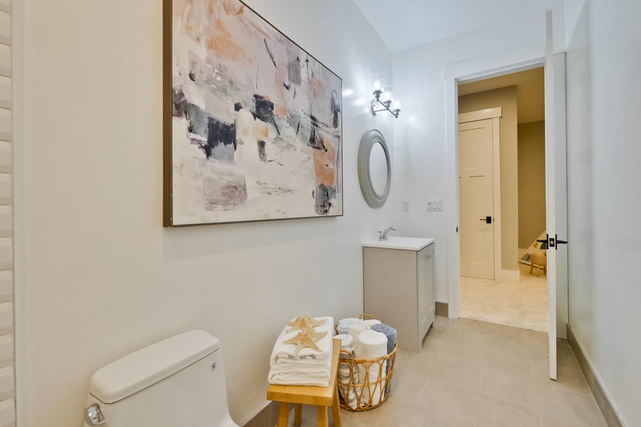 10326 Prune Tree Lane Cupertino, CA 95014 - Photo 57 of 95 a bathroom with a toilet sink and mirror