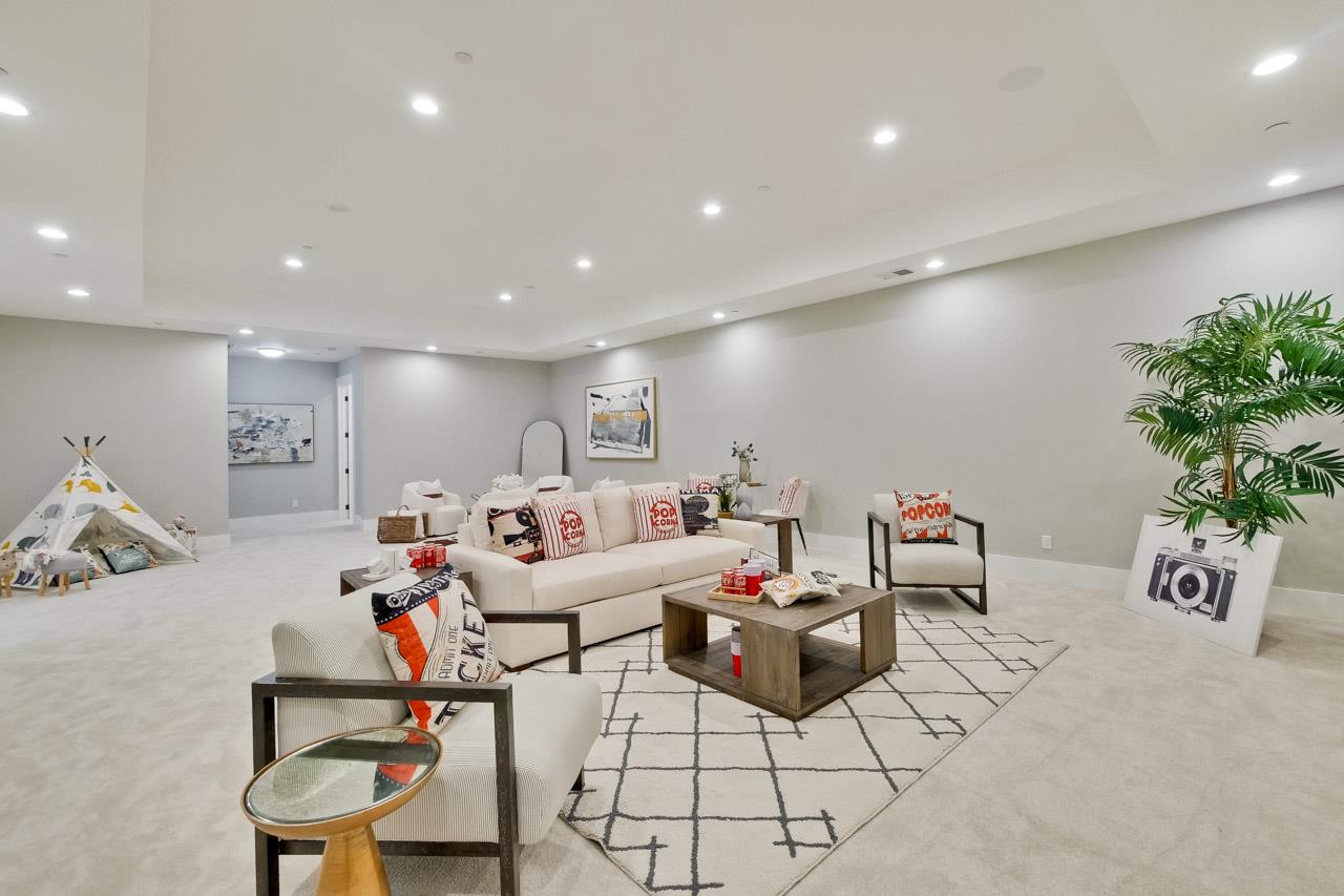 10326 Prune Tree Lane Cupertino, CA 95014 - Photo 67 of 95 a living room with furniture and a potted plant