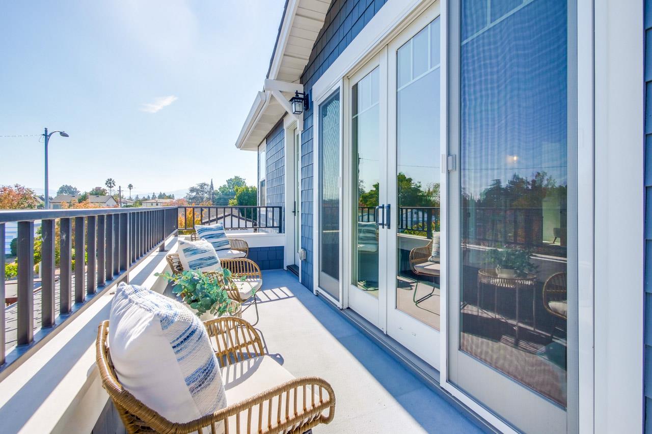 10326 Prune Tree Lane Cupertino, CA 95014 - Photo 76 of 95 a balcony with furniture and a potted plant