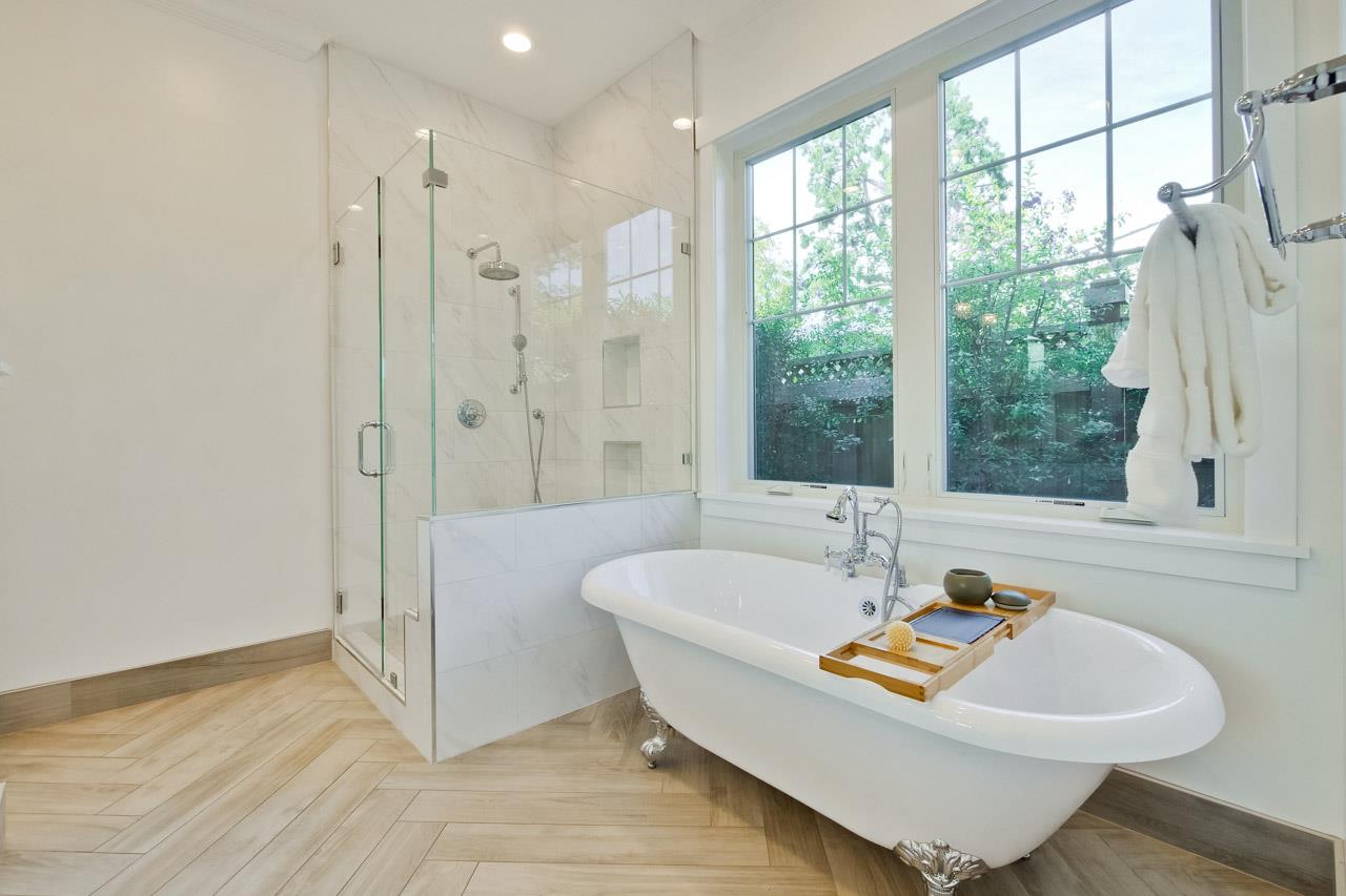 10326 Prune Tree Lane Cupertino, CA 95014 - Photo 80 of 95 a bath tub sitting in a bathroom next to a window