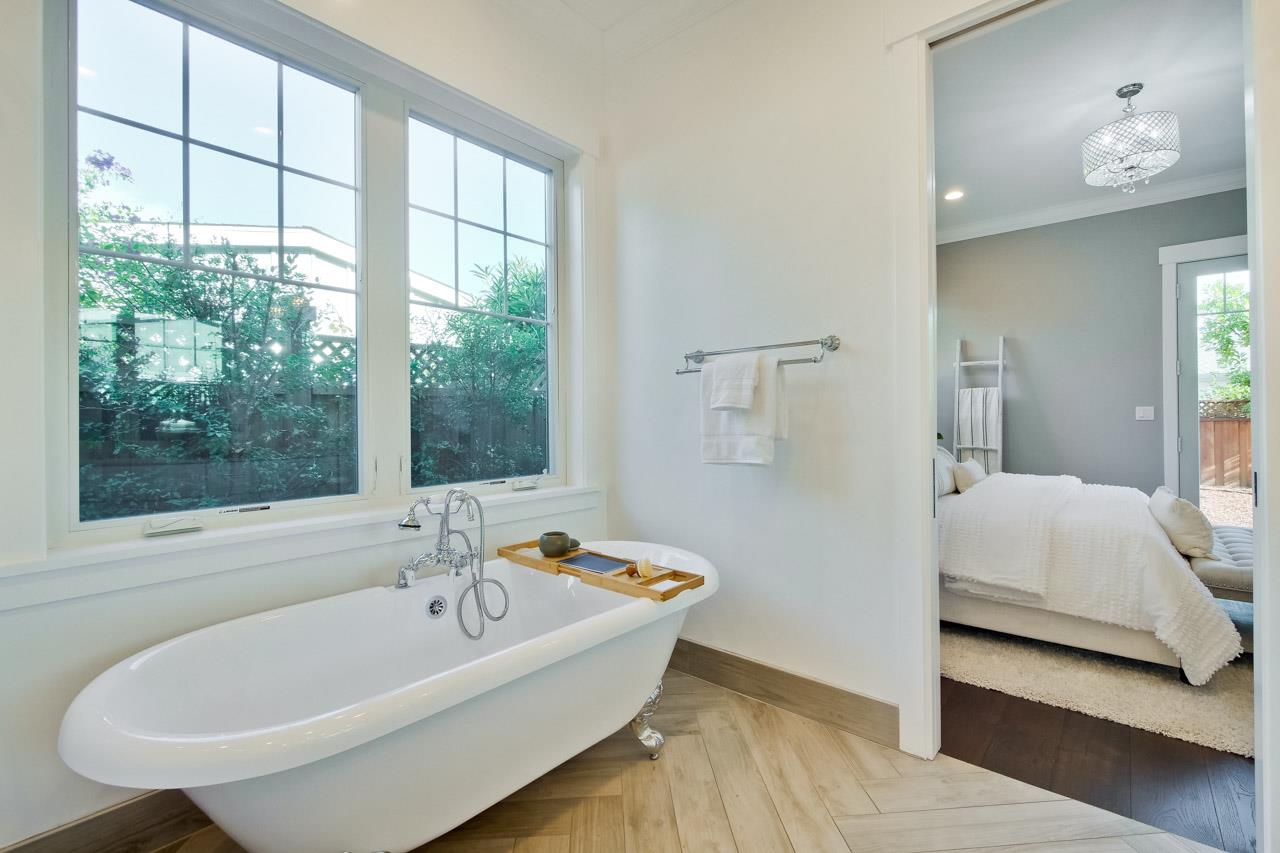 10326 Prune Tree Lane Cupertino, CA 95014 - Photo 8 of 95 a bathroom with a tub and a large window