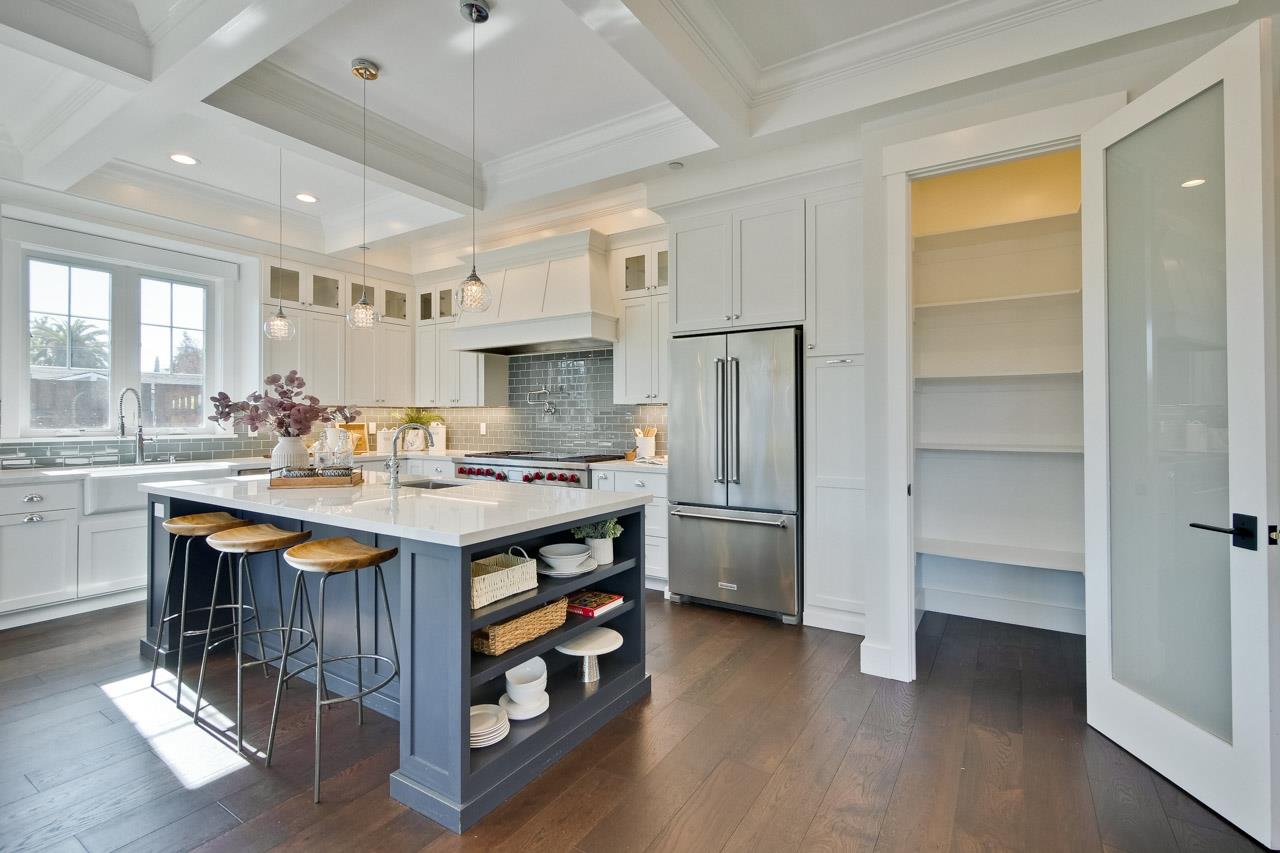 10326 Prune Tree Lane Cupertino, CA 95014 - Photo 85 of 95 a kitchen with kitchen island a sink stove and refrigerator