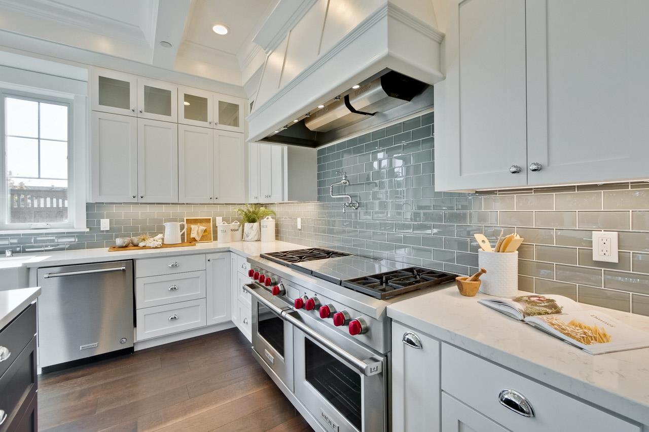 10326 Prune Tree Lane Cupertino, CA 95014 - Photo 92 of 95 a kitchen with a stove and white cabinets