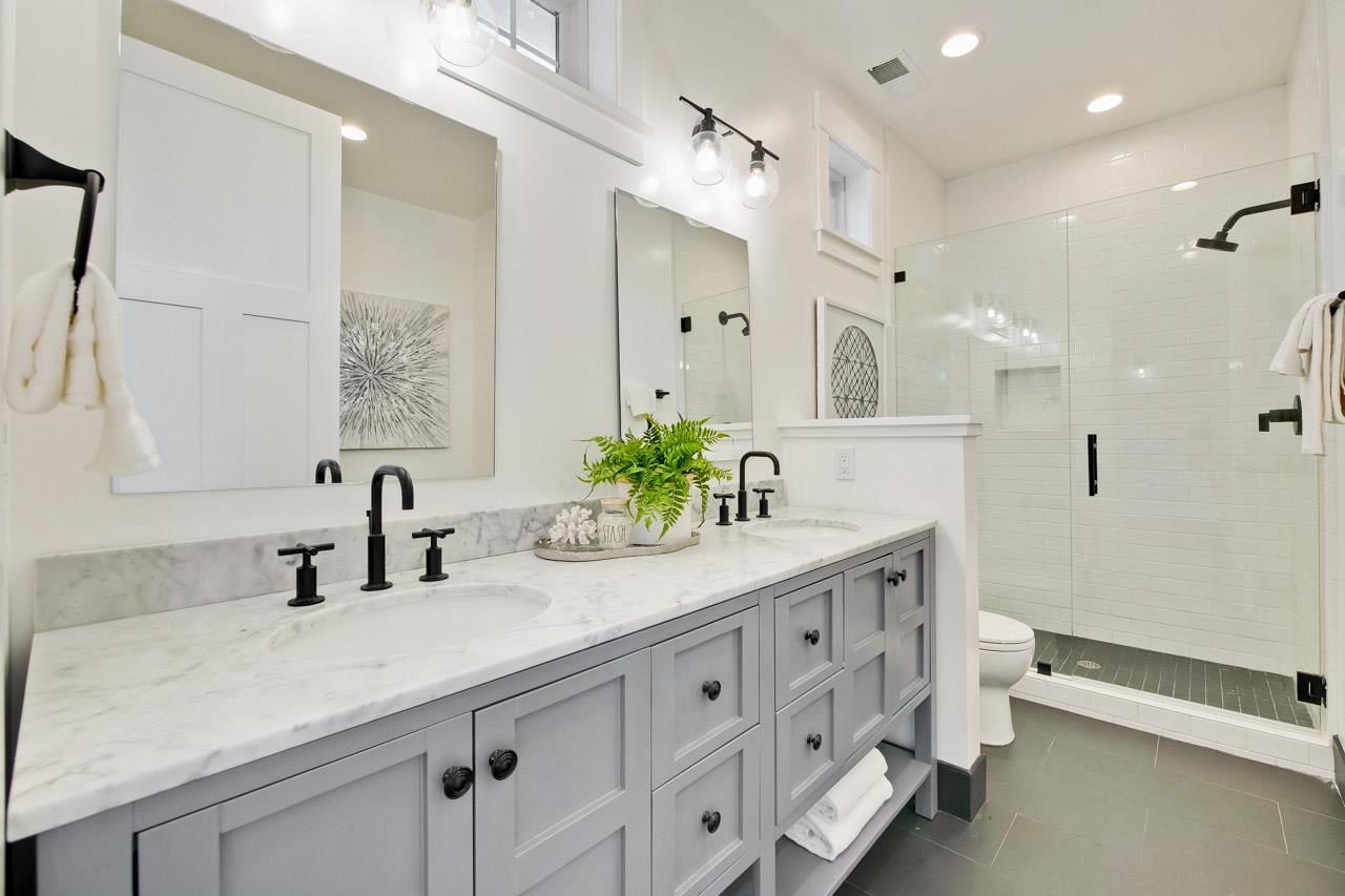 10326 Prune Tree Lane Cupertino, CA 95014 - Photo 93 of 95 a bathroom with a double vanity sink mirror and toilet