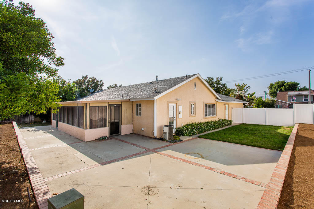 2460 Fitzgerald Road Simi Valley, CA 93065 - Photo 3 of 35 a view of a house with a yard and large tree