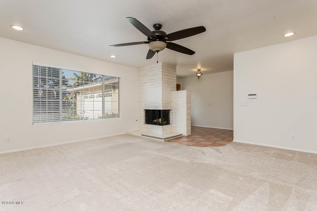 2460 Fitzgerald Road Simi Valley, CA 93065 - Photo 6 of 35 an empty room with ceiling fan and windows