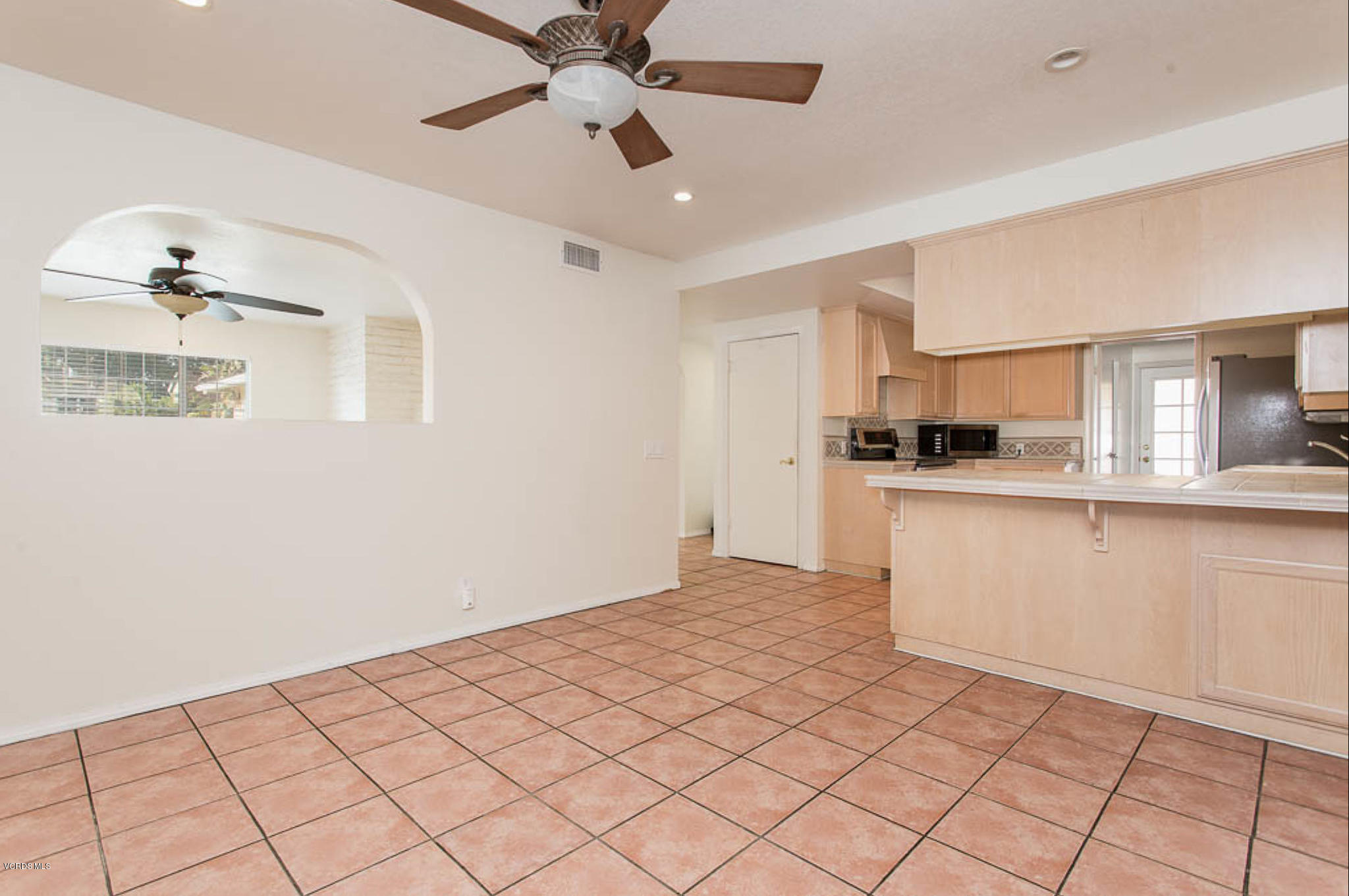 2460 Fitzgerald Road Simi Valley, CA 93065 - Photo 10 of 35 a kitchen with granite countertop a sink cabinets and stainless steel appliances