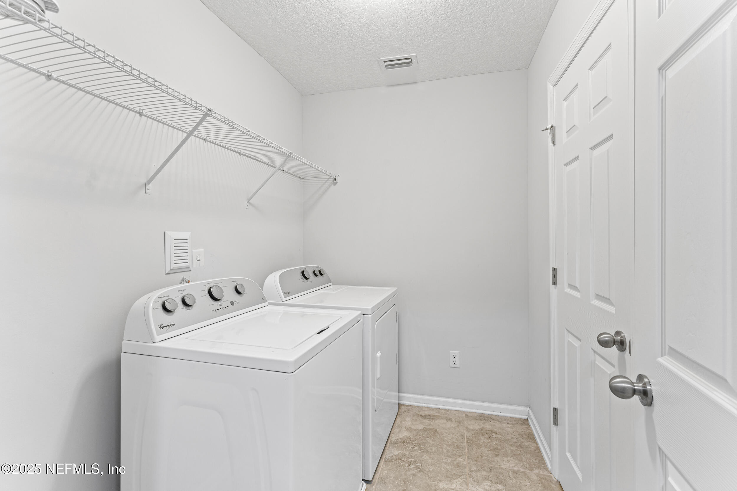 245 Richmond Drive St. Johns, FL 32259 - Photo 13 of 18 a utility room with dryer and washer