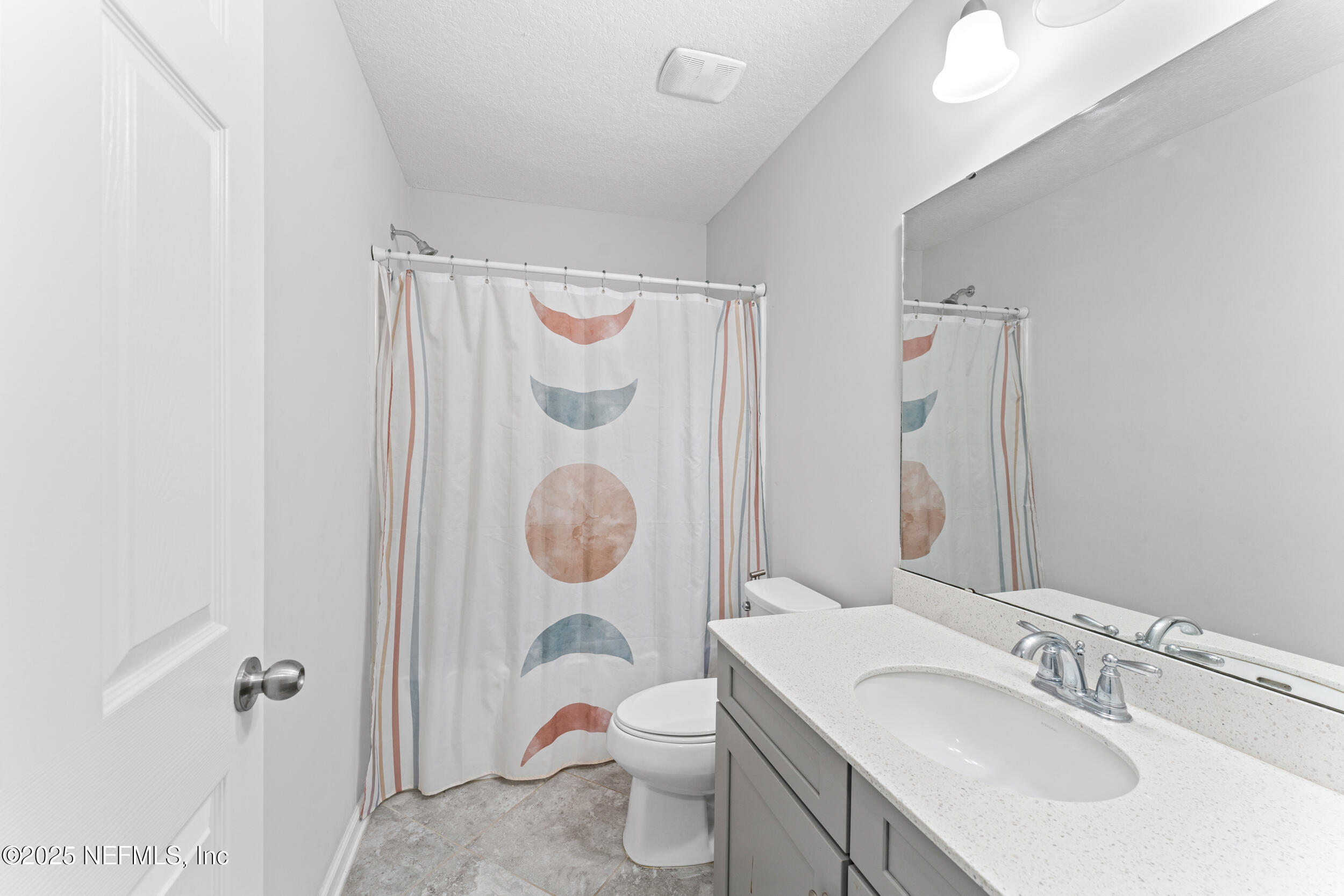 245 Richmond Drive St. Johns, FL 32259 - Photo 15 of 18 a bathroom with a toilet sink and mirror