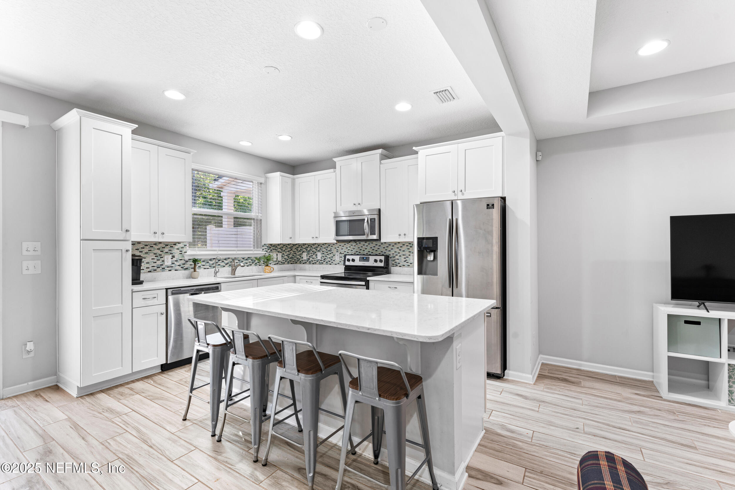 245 Richmond Drive St. Johns, FL 32259 - Photo 5 of 18 a kitchen with stainless steel appliances a refrigerator stove microwave and cabinets
