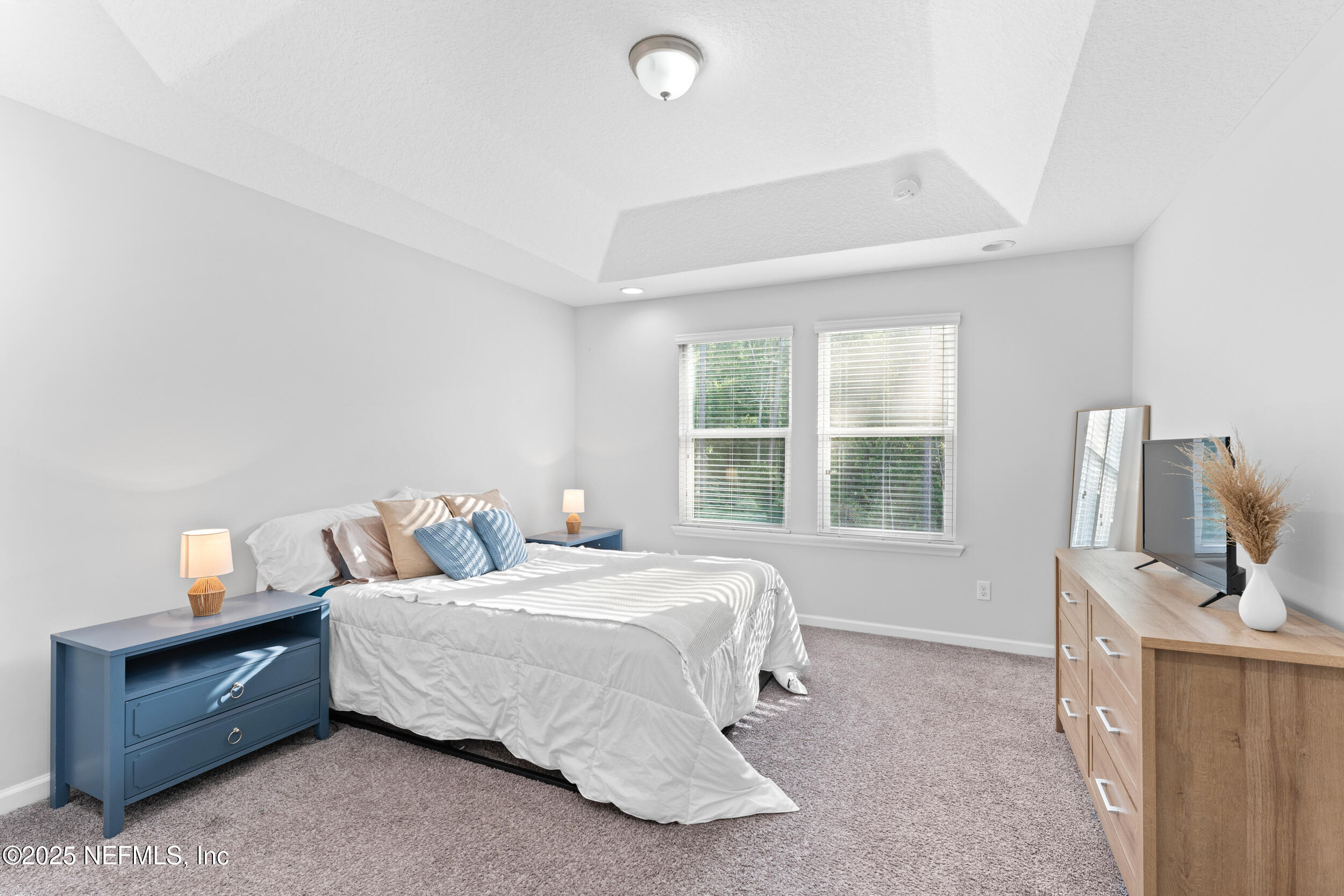 245 Richmond Drive St. Johns, FL 32259 - Photo 9 of 18 a bedroom with a bed and a window