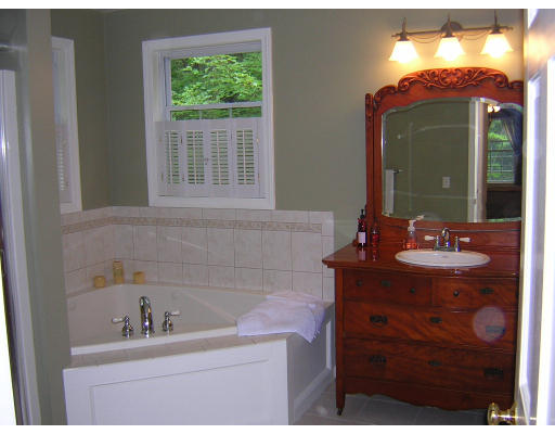 24 Sassawanna Road Rutland, MA 01543 - Photo 11 of 14 a bathroom with a sink vanity and mirror