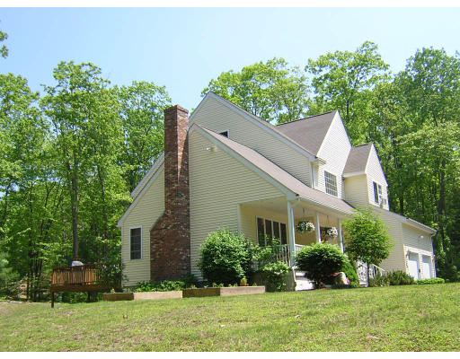 24 Sassawanna Road Rutland, MA 01543 - Photo 2 of 14 front view of a house with a yard