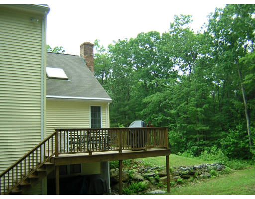 24 Sassawanna Road Rutland, MA 01543 - Photo 3 of 14 a view of a deck with a wooden fence